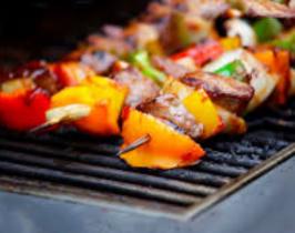 Sublime Lamb Kebabs cooking over Hot Charcoals.