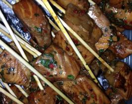 Marinated salmon skewers with a lime and coriander dip